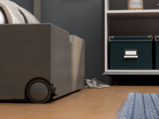 Ruedas de diseño Robby NOA instaladas en una cama gris, ofreciendo movilidad y un estilo moderno y funcional.